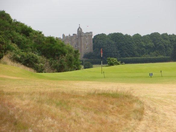 The green on the 4th seems dwarfed by a castle almost a mile away.