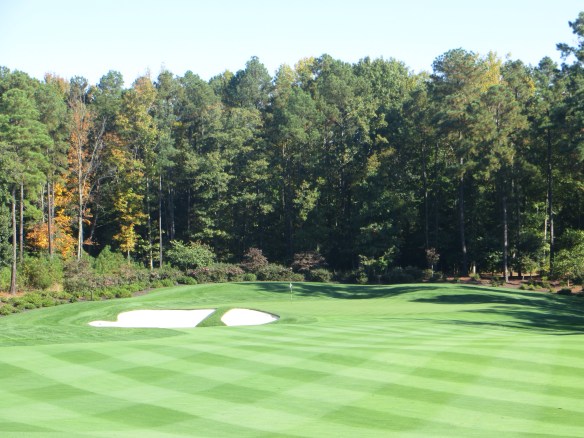 The first green frames the beauty of this property right out of the gate.
