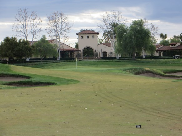 There club house frames the approach into #9