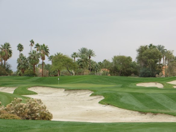 Full carry required across the long waste area to 12 green. 