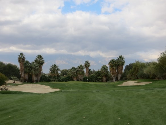 Lush fairways, framing palms, and mountain back drops-what a formula.