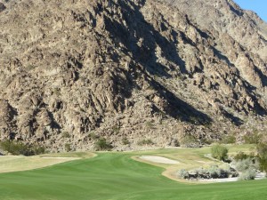 Approach to 14 is set against the mountain backdrop
